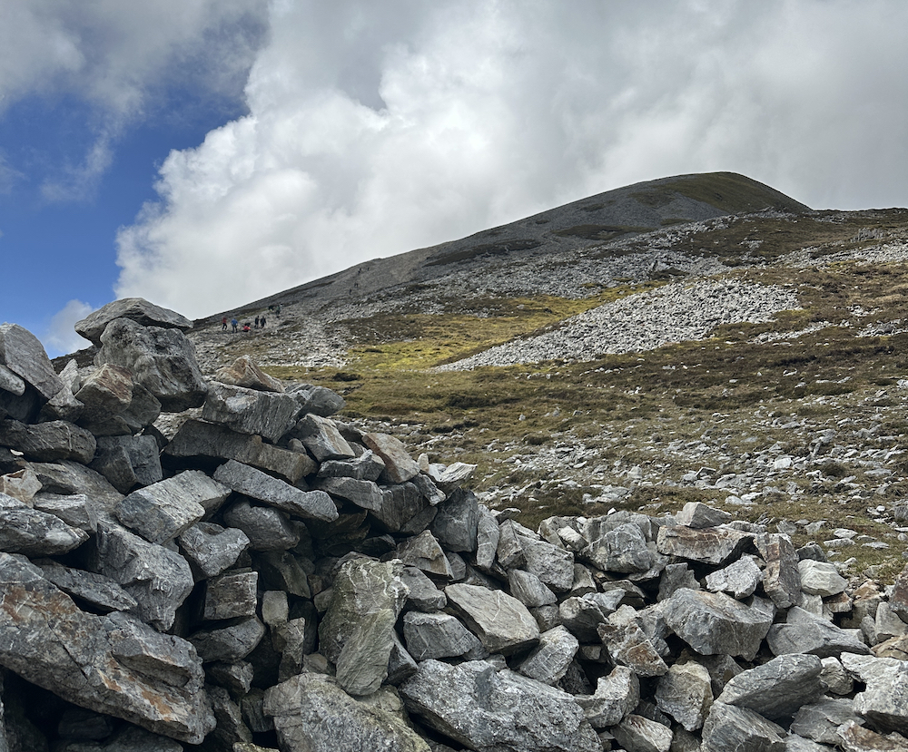Irish Expressions: Hiking Croagh Patrick.  Rock pile and view of the summit.