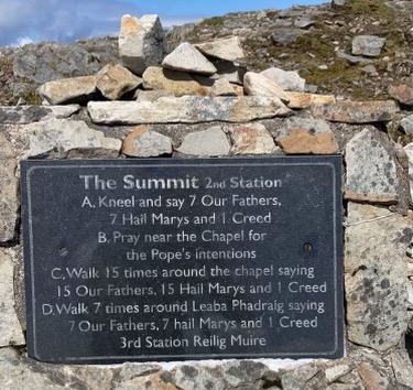 Irish Expressions:  Hiking Croagh Patrick.  The sign marking the summit.