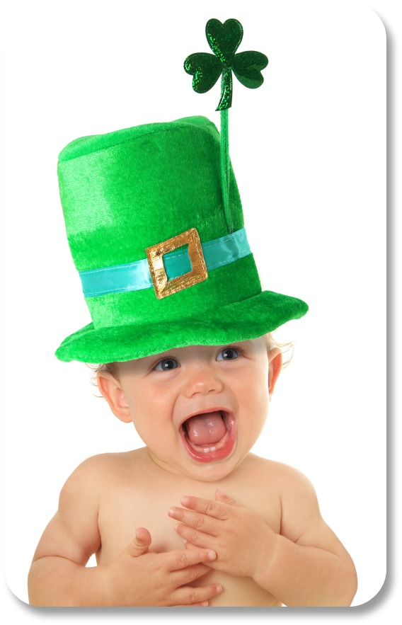 Delighted baby wearing leprechan hat with shamrock.