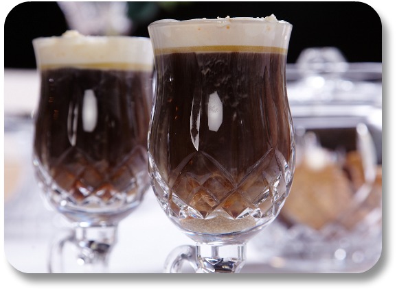 Two well prepared Irish Coffees in cut glass presentation.