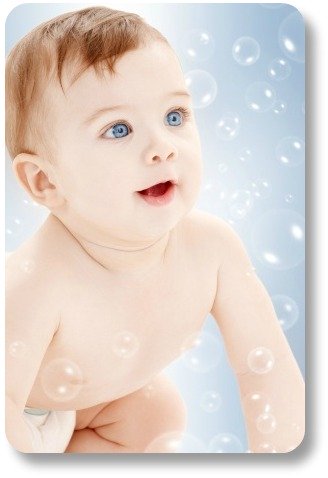 Irish baby boy names.  Blue-eyed red-haired baby with bubbles.