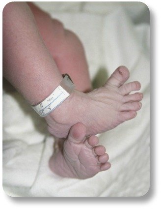 Irish Baby Names.  Feet of newborn with name bracelet.