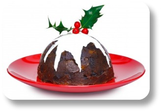 Irish Christmas pudding recipe.  WIth holly on a red plate.